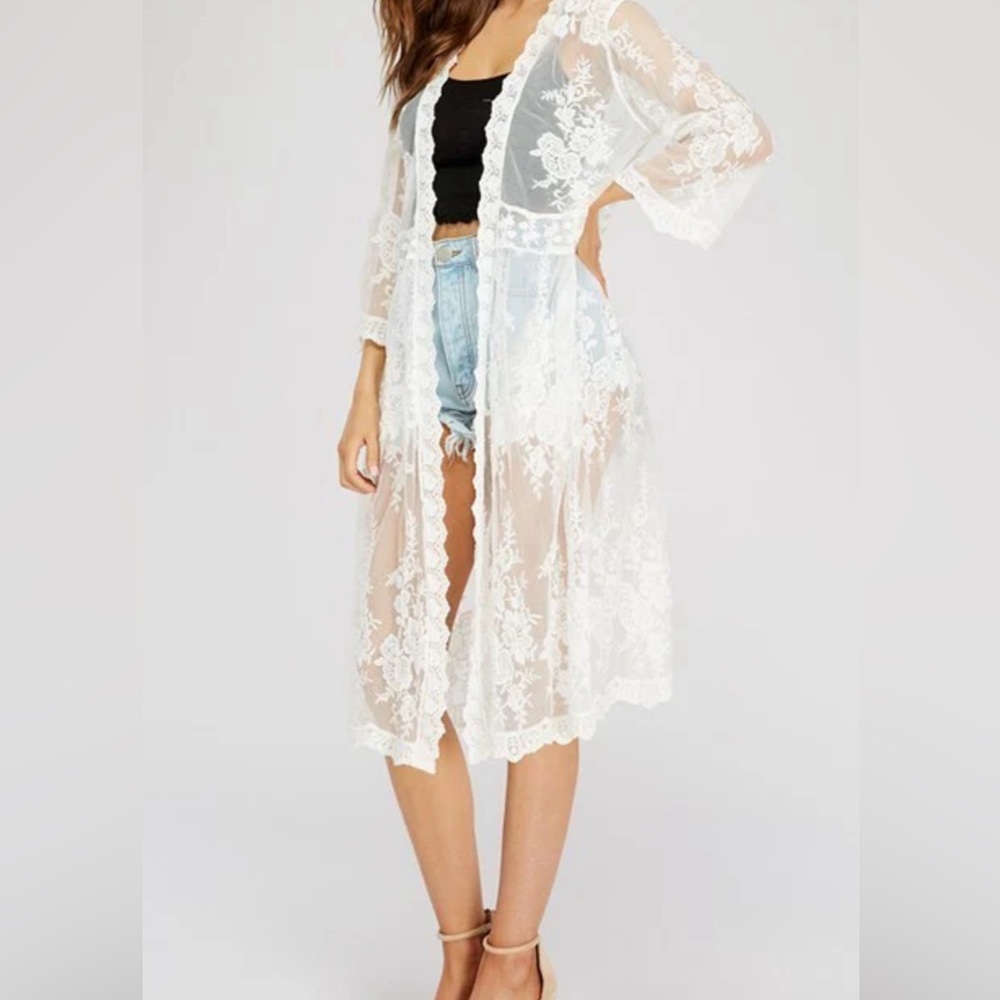 While Lace Cover Up for Swimsuit or shorts. One size only. Perfect for Summer